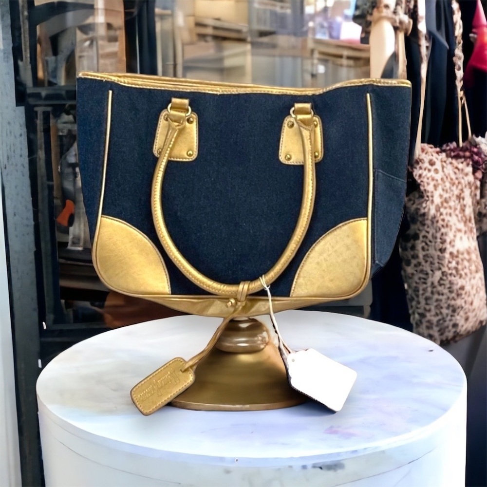 Neiman Marcus jean and gold shoulder bag.